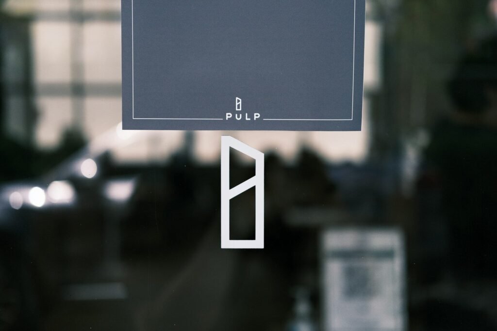 a close up of a sign on a glass door